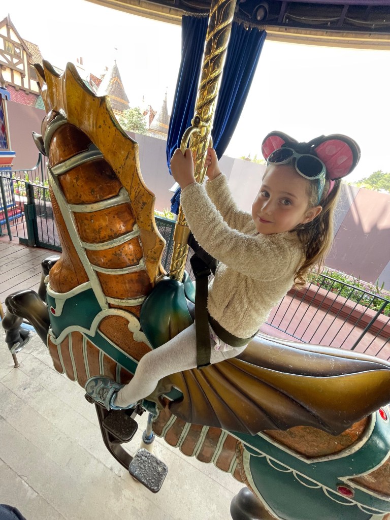 Riding the carousel at Disney
